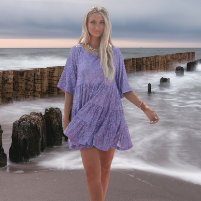 LM : Casual, shiny babydoll dress with a swinging cut